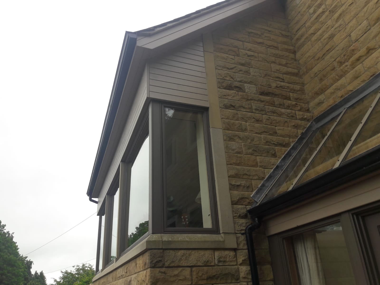 Exterior wood Cladding and window hand painted by professional Painter & Decorator Gareth Thompson in Cookridge, Leeds