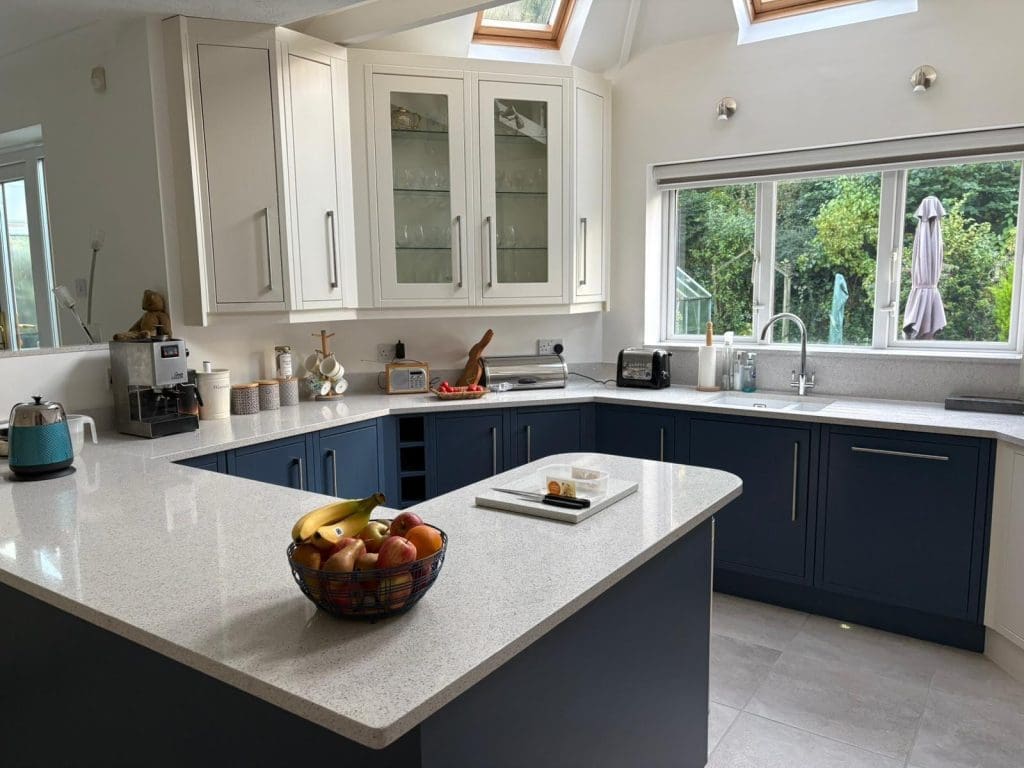 Two-tone hand painted kitchen with striking blue contrast cabinets